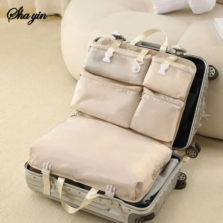 Travella 6-en-1 Sac de rangement de voyage pliable | Suspendu & Portable | Sac multifonction pour vêtements, cosmétiques & accessoires | Gris/Beige/Rose